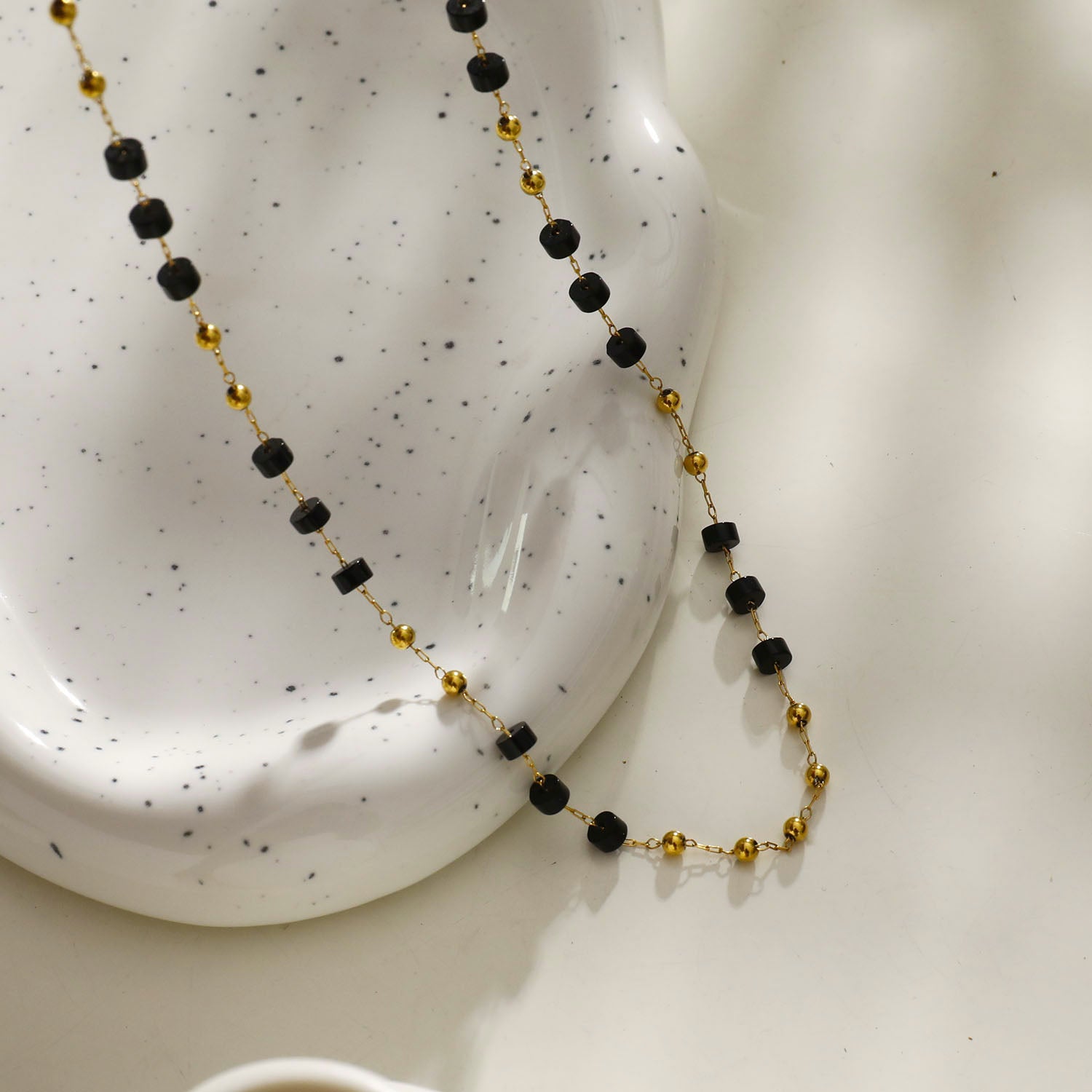 Style: SANTA CRUZ 22107 Black Onyx and Gold Beaded Chain Necklace.